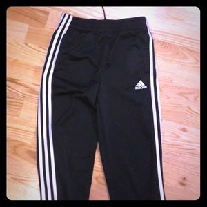 Black full length Adidas pants for boys or girls.